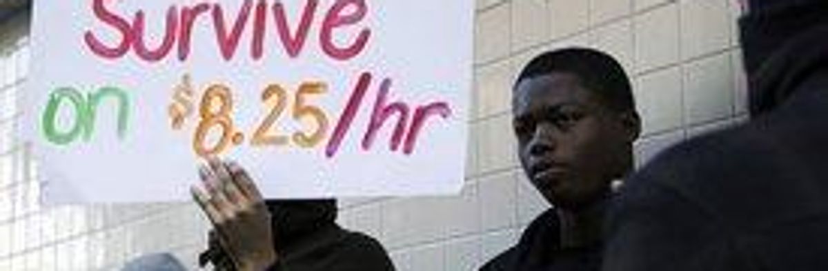 Wage protesters stand outside a McDonald's in Oakland , CA