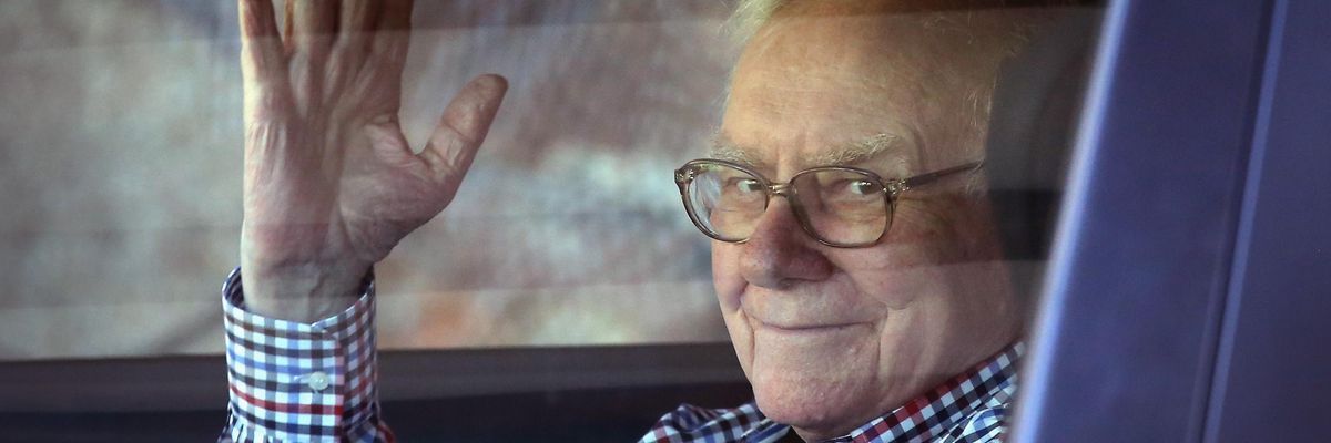 Warren Buffett, chairman of Berkshire Hathaway Inc., waving