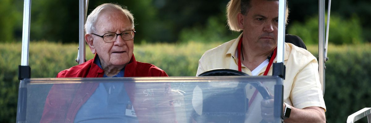 Warren Buffett, the chairman and CEO of Berkshire Hathaway, rides in a golf cart