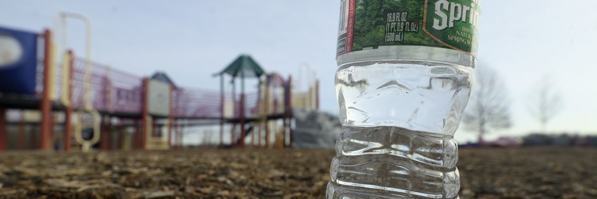 Water bottle shown near PFAS-contaminated area.