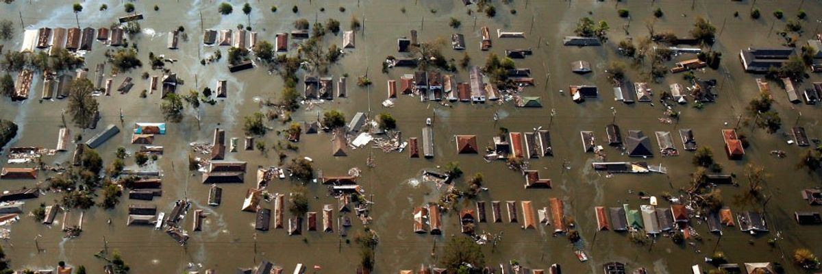 Water from Katrina surrounds homes in Ninth Ward of New Orleans.