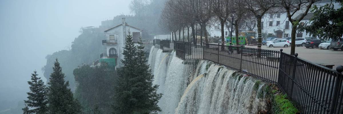 Water pours off a bridge due to massive flooding in Grazalema, Spain.