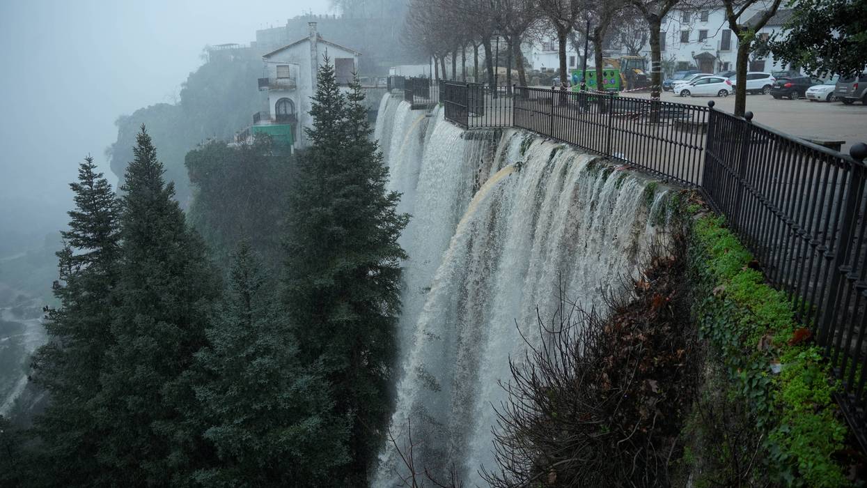 Water pours off a bridge due to massive flooding in Grazalema, Spain.