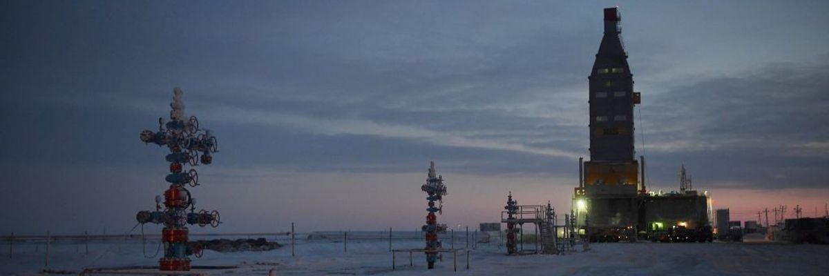 Wellhead equipment against an Arctic twilight. 