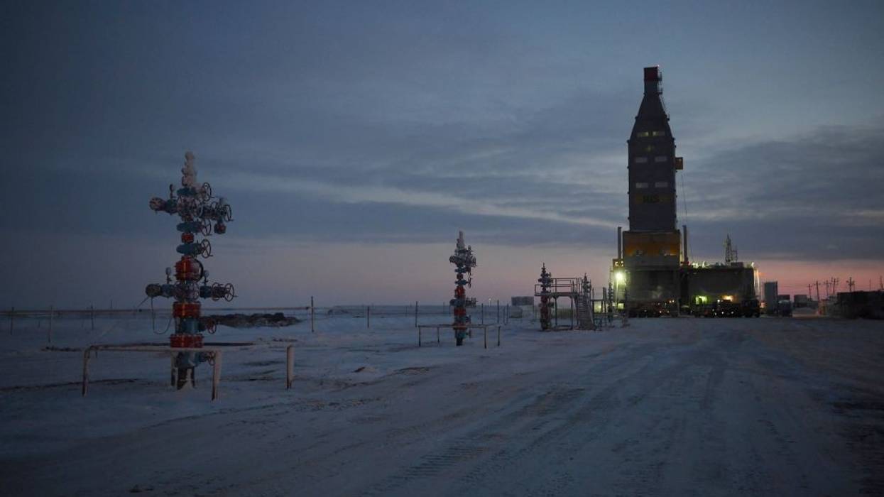 Wellhead equipment against an Arctic twilight.