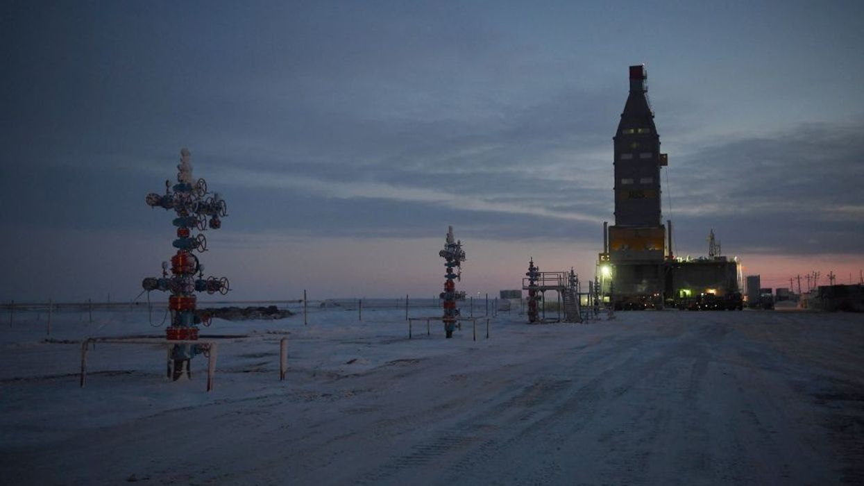 Wellhead equipment against an Arctic twilight.