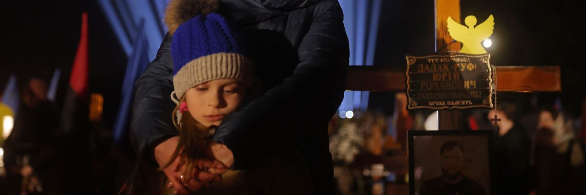 Widow and her child commemorate 1 year anniversary of Russian invasion of Ukraine