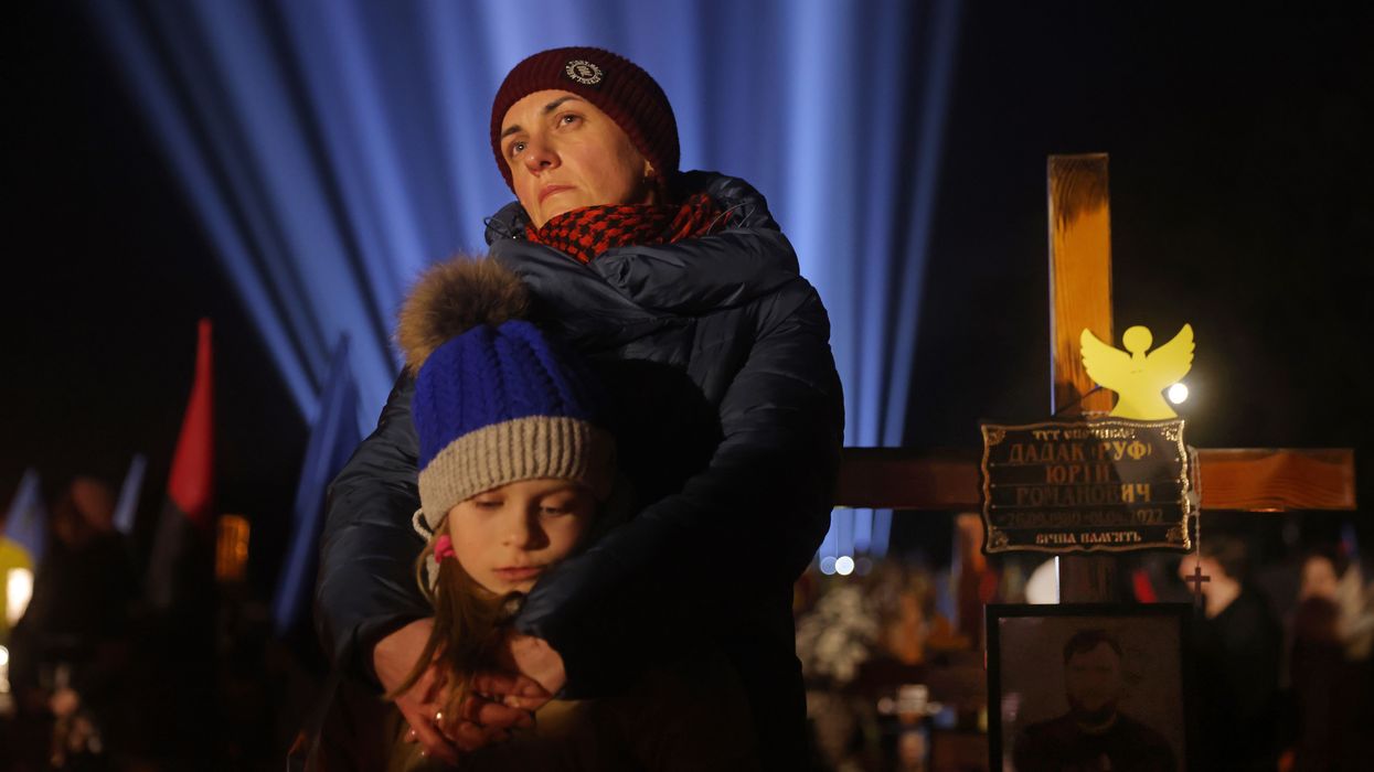 Widow and her child commemorate 1 year anniversary of Russian invasion of Ukraine