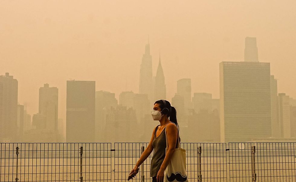 Wildfire smoke from Canada shrouds the New York City skyline days before the FIFA World Cup final in New Jersey.