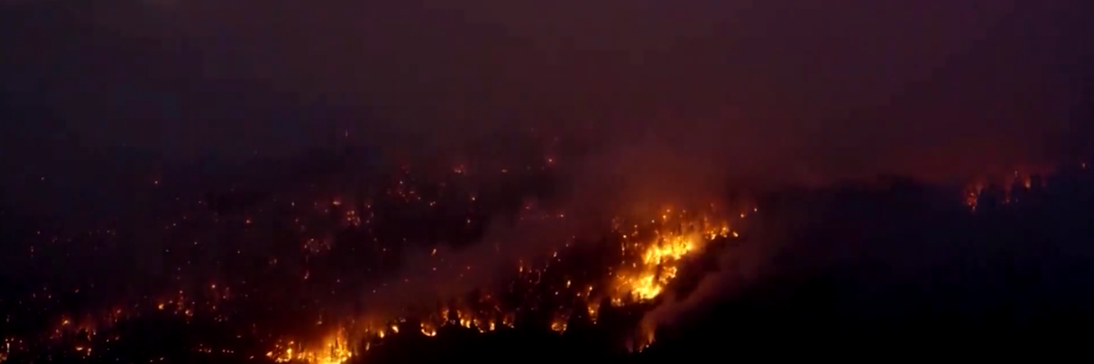 Wildfires are seen in a forest in the Northwest Territories, Canada.