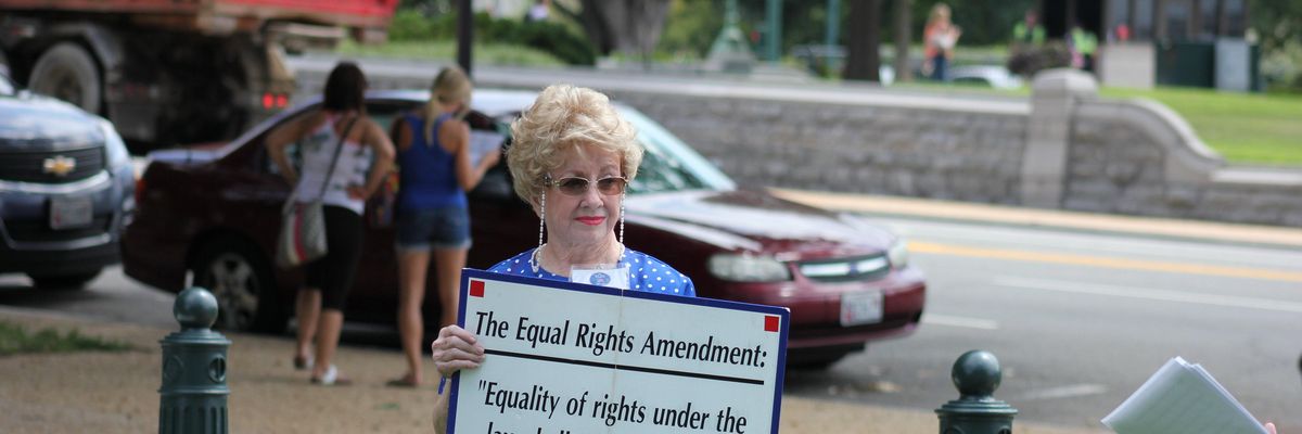 Woman holds ERA sign