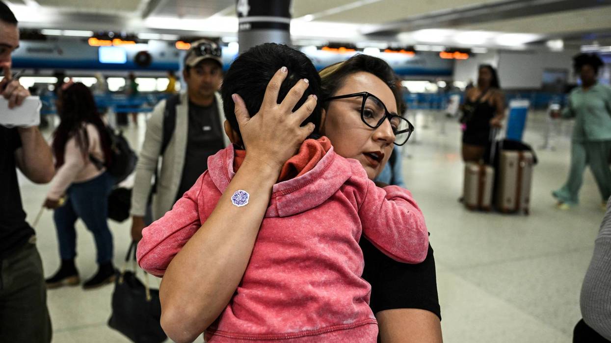 Woman hugs child