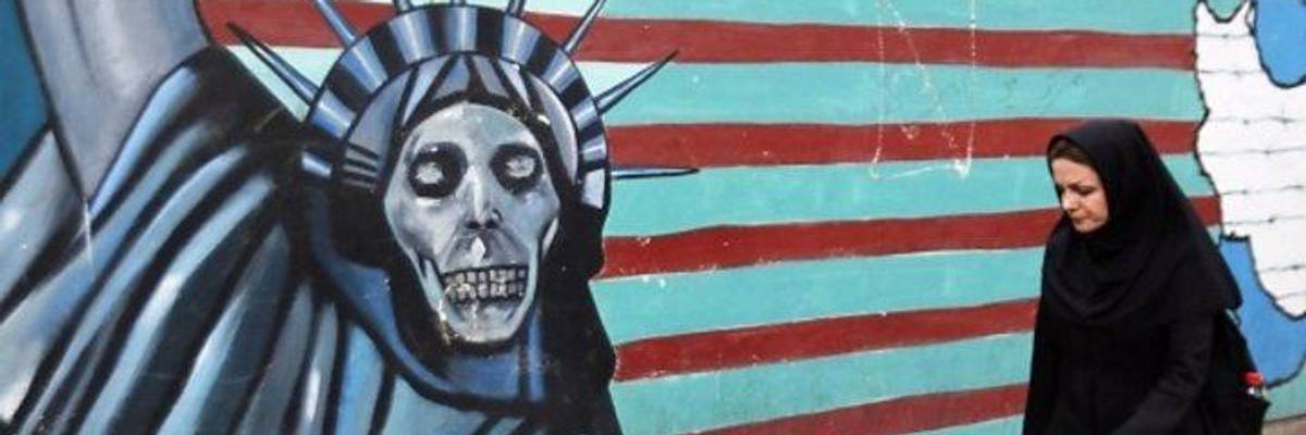 Who's Reacting to Iran Deal Pull-Out? Why, It's Women in Chadors, Walking Past Anti-US Mural