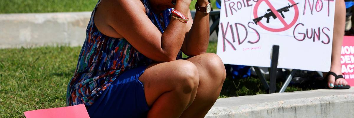 Woman mourning gun massacre