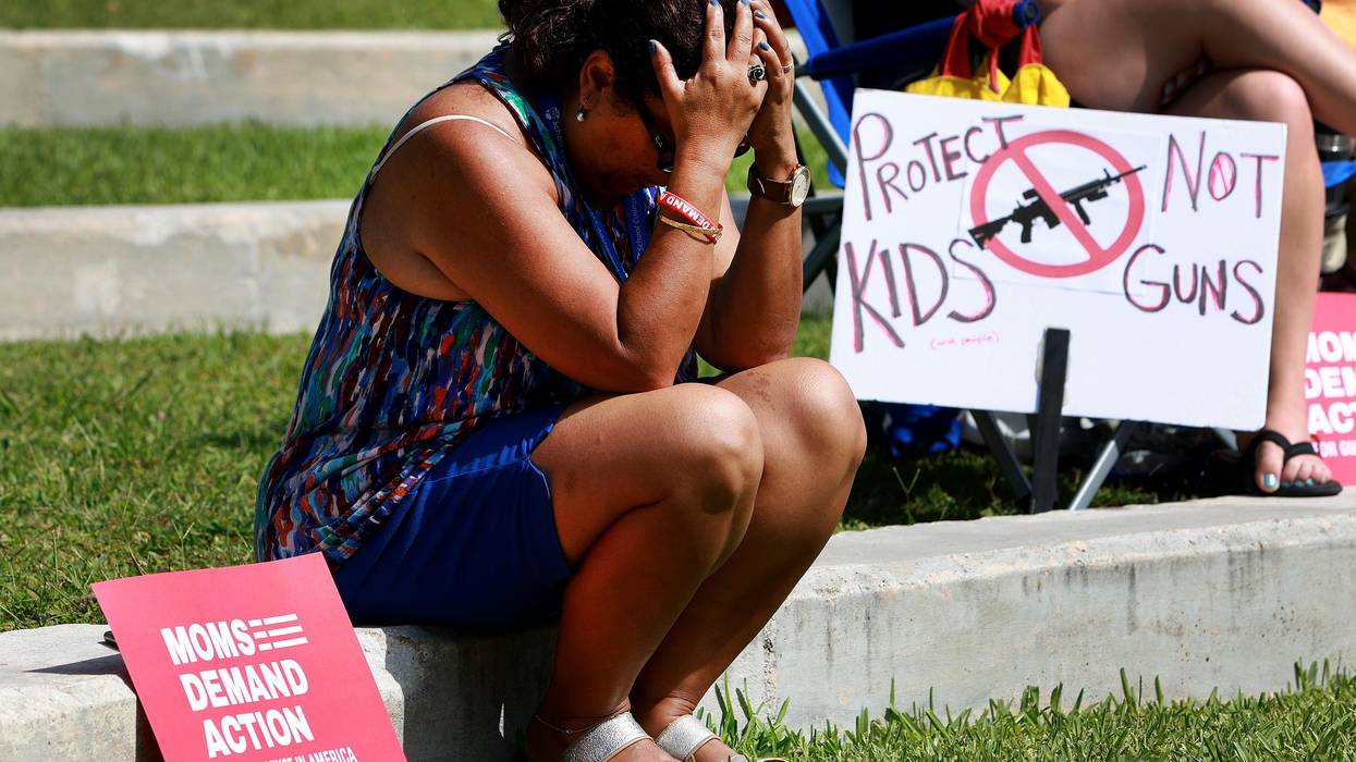 Woman mourns victims of gun violence