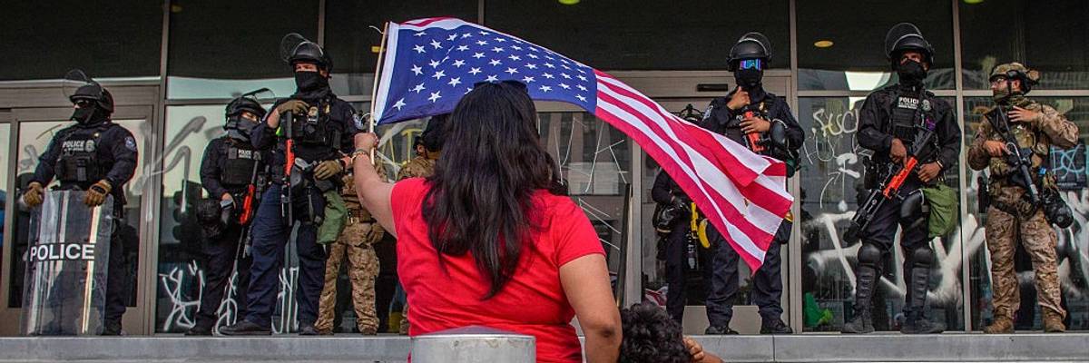 Woman protests California National Guard