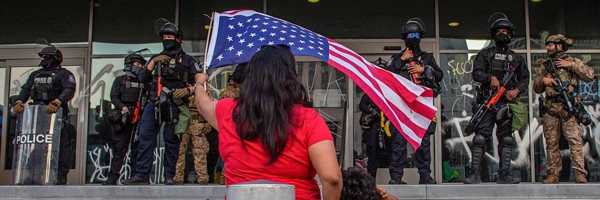 Woman protests California National Guard