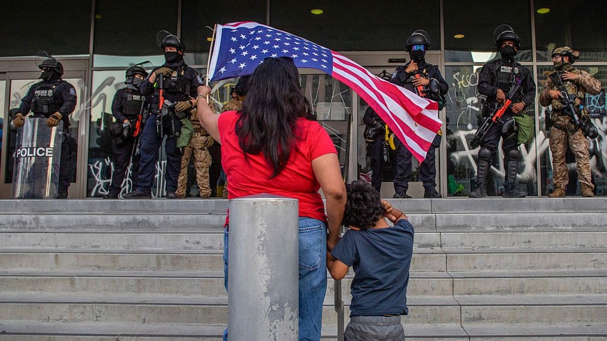 Woman protests California National Guard