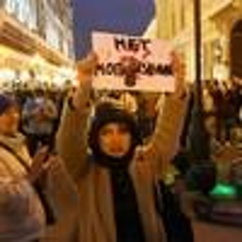 Woman protests Russia's war in Ukraine