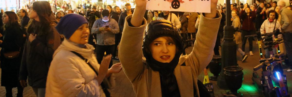 Woman protests Russia's war in Ukraine