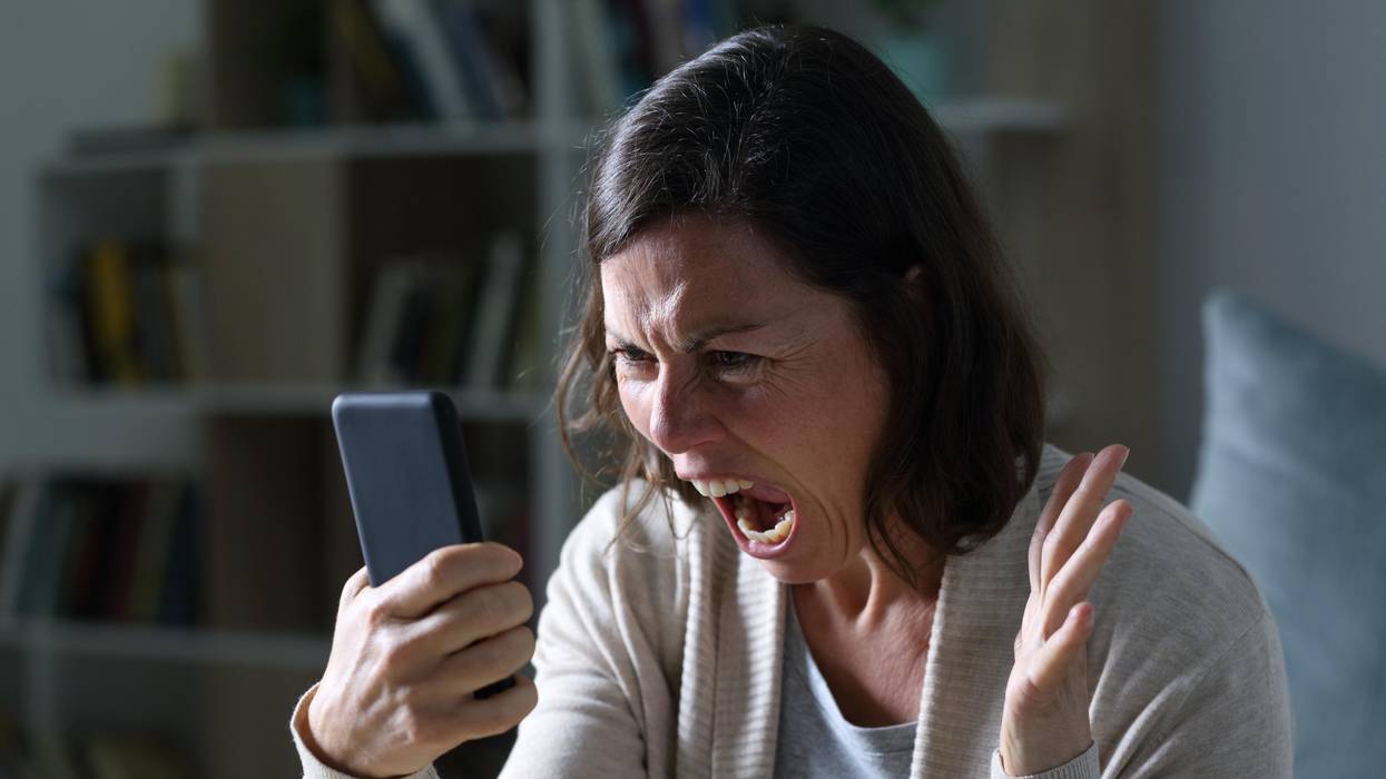 Woman screaming at smart phone