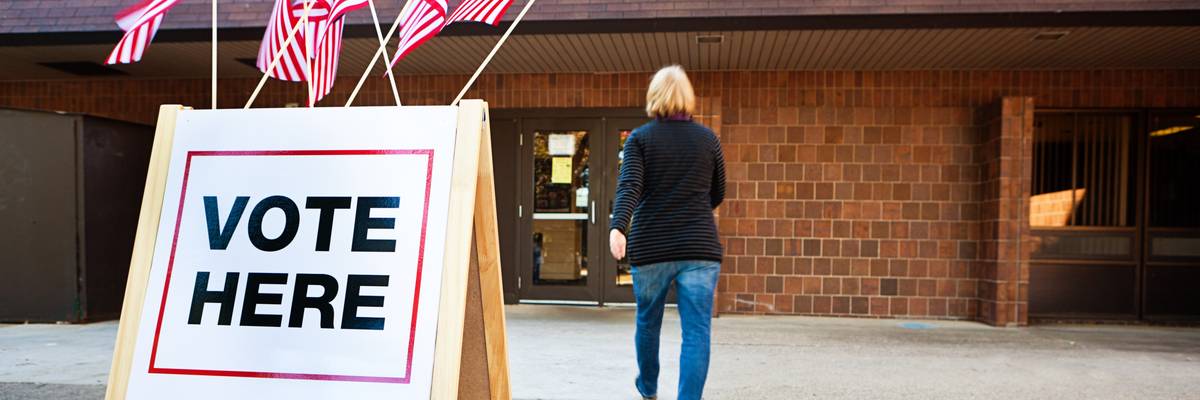 Woman Voter Entering Voting Polling Place for USA Government Election