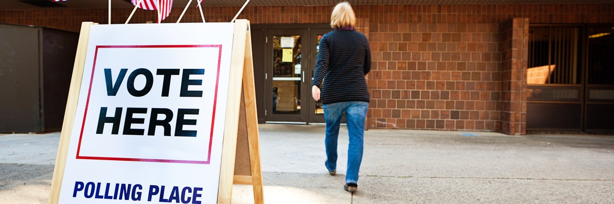 Woman Voter Entering Voting Polling Place for USA Government Election