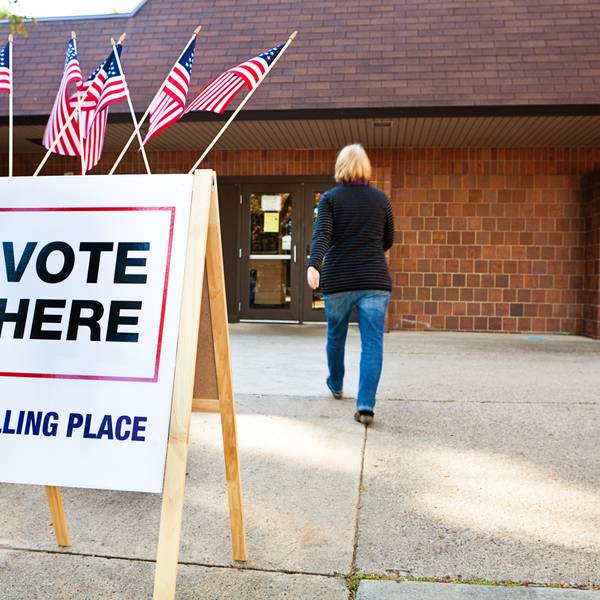 Woman Voter Entering Voting Polling Place for USA Government Election