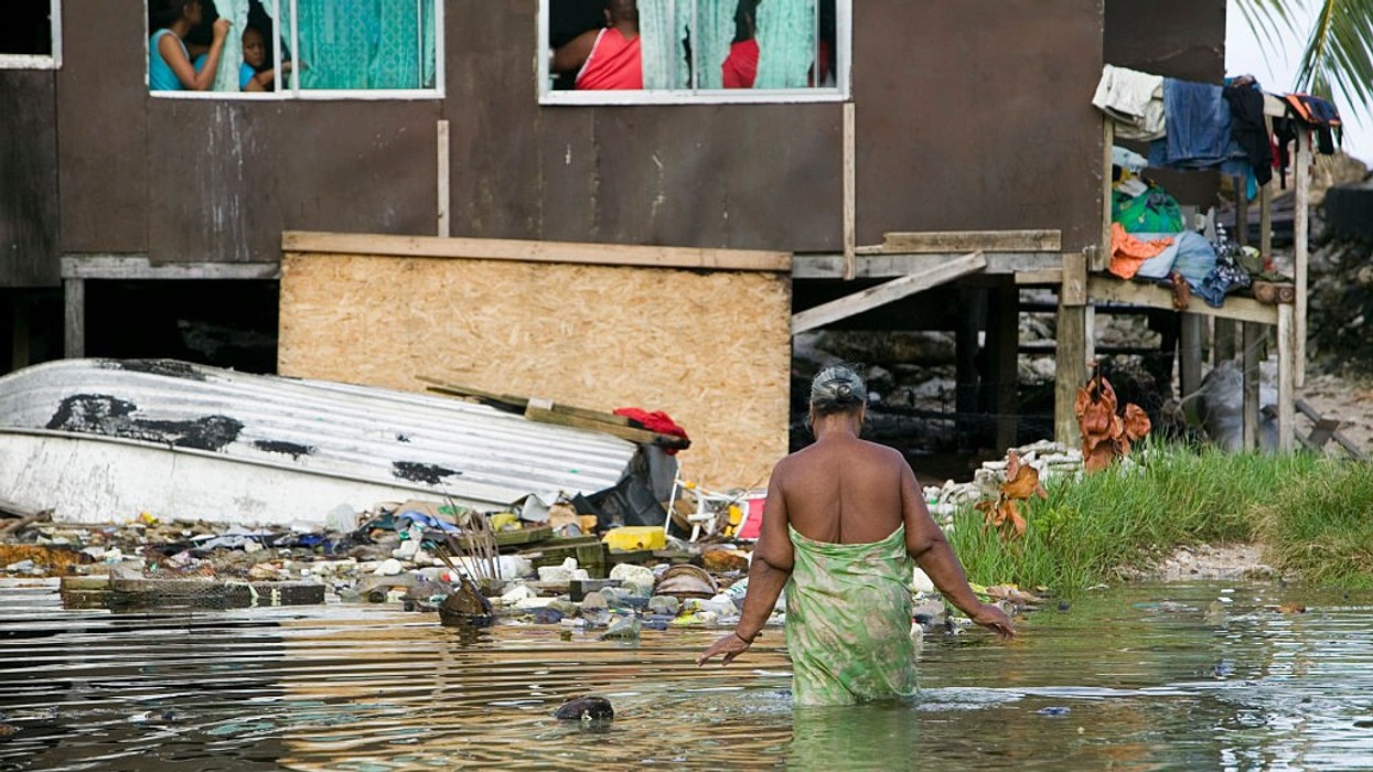 Woman wades through waters in Funafuti Atoll