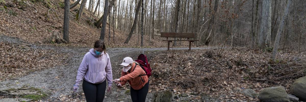 women collect water samples