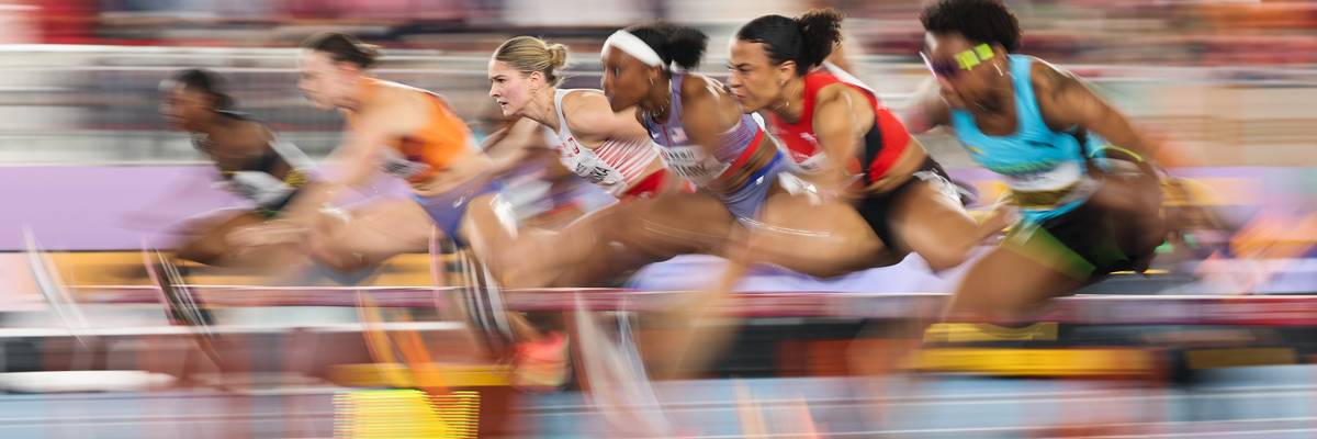 Women compete in a track event.