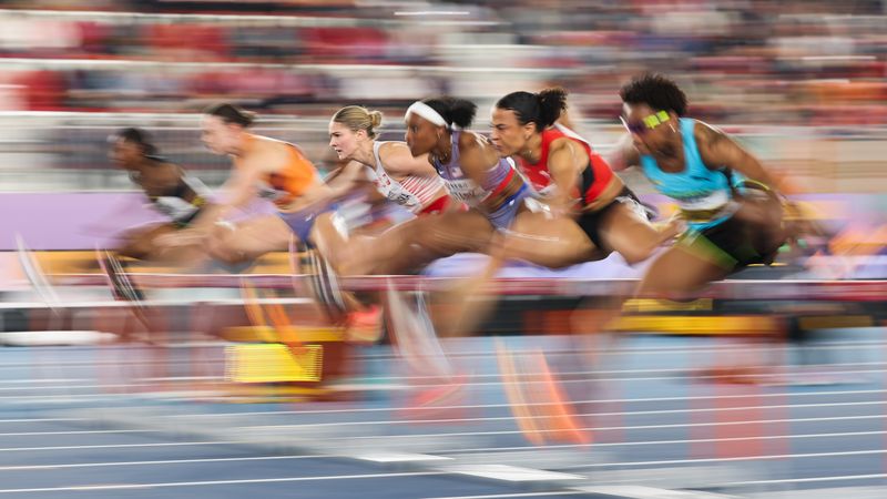 Women compete in a track event.