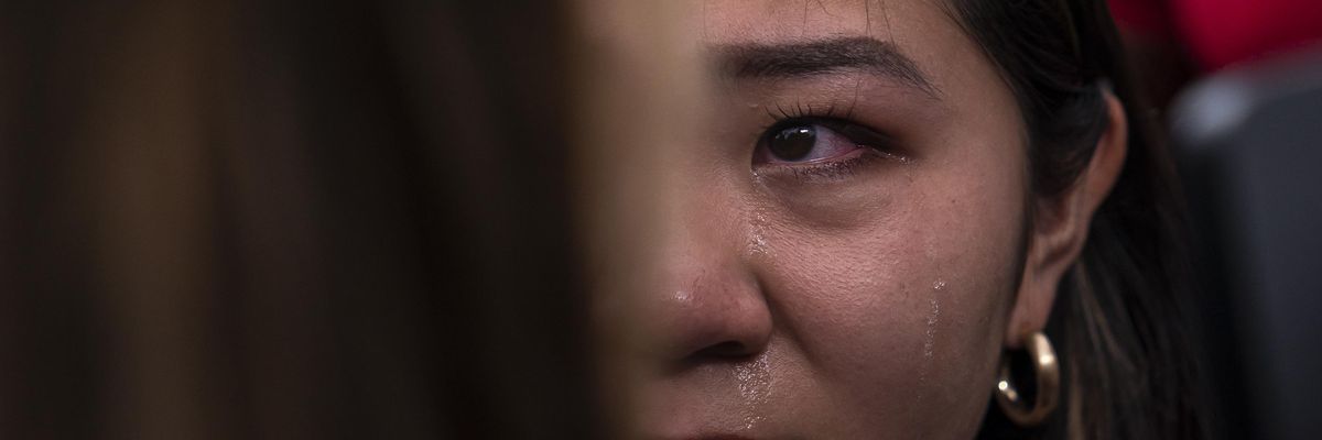 Women cries after Supreme Court overturns Roe