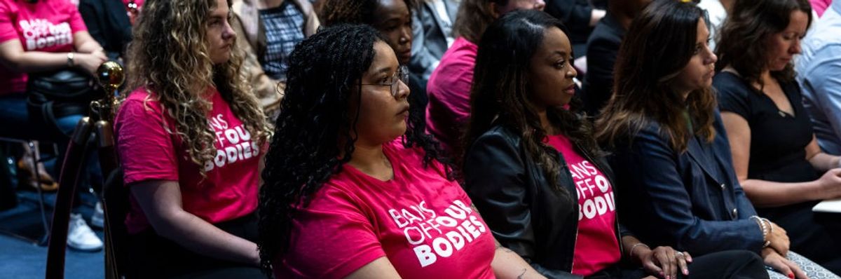 Women fill the room during a Senate hearing