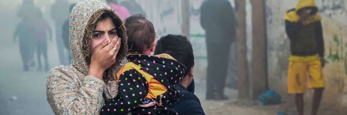 Women Holding child in Gaza