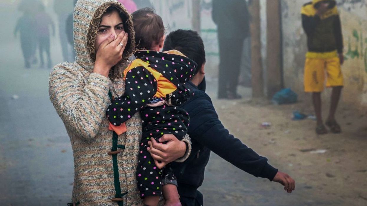 Women Holding child in Gaza