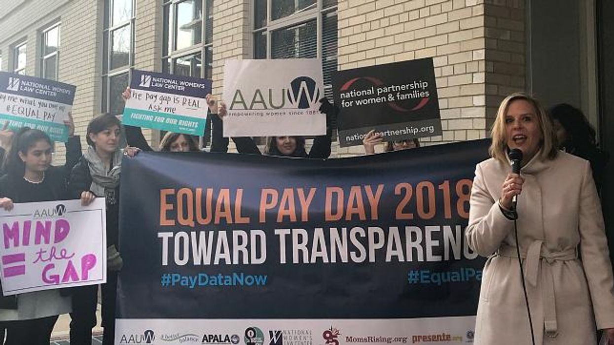 Women protest on Equal Pay Day.