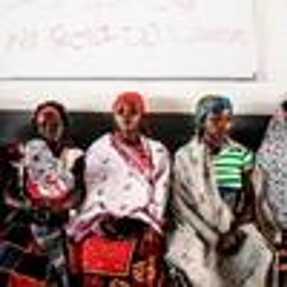 Women wait for medical care at a clinic in Mozambique.