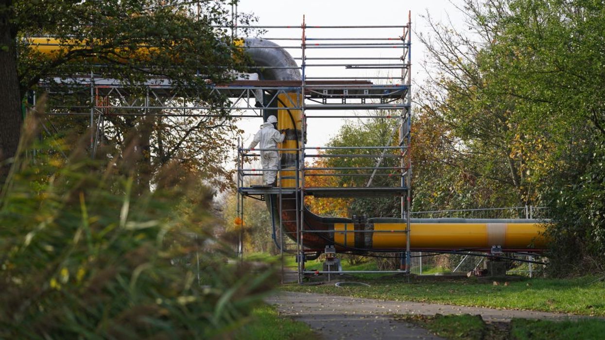 Workers assemble pipelines for a planned liquefied natural gas floating terminal