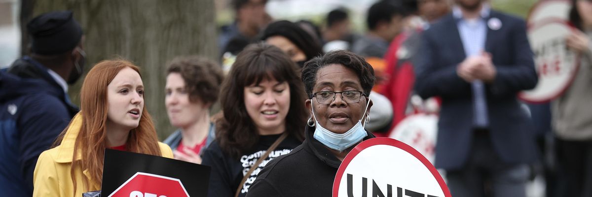 Workers demonstrating against "corporate greed"