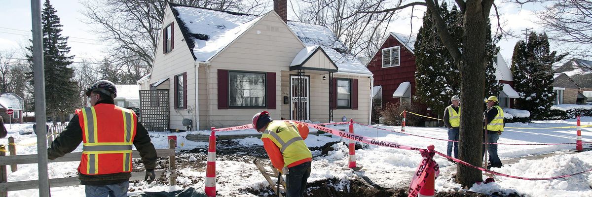 Workers excavating lead pipes in Flint