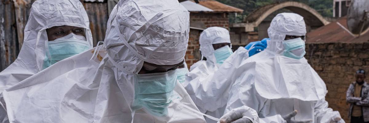 Workers from the Uganda Red Cross Society don protective suits