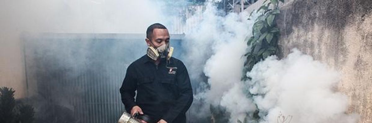 Workers fumigating a Zika outbreak in Caracas, Venezuela