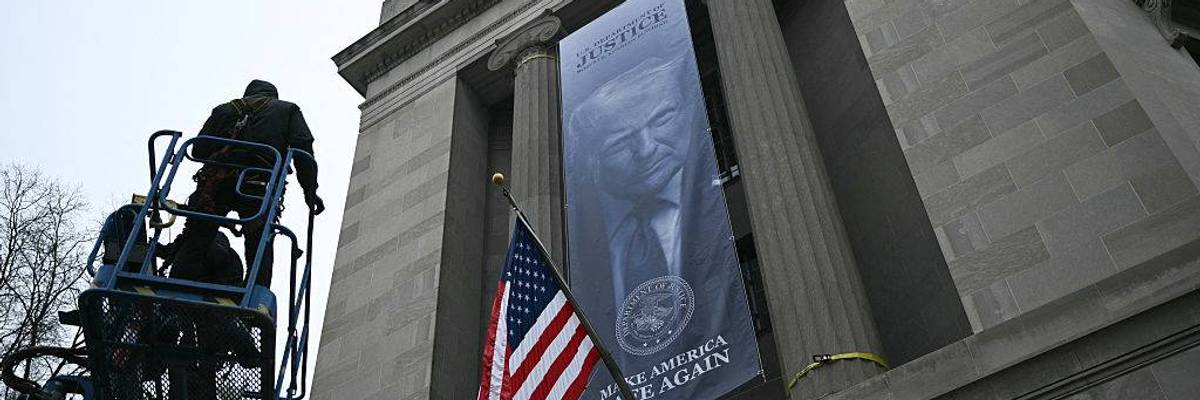 'An Abomination': Enormous 'Dictatorship-Style' Banner With Trump Face on Side of Justice Department Decried