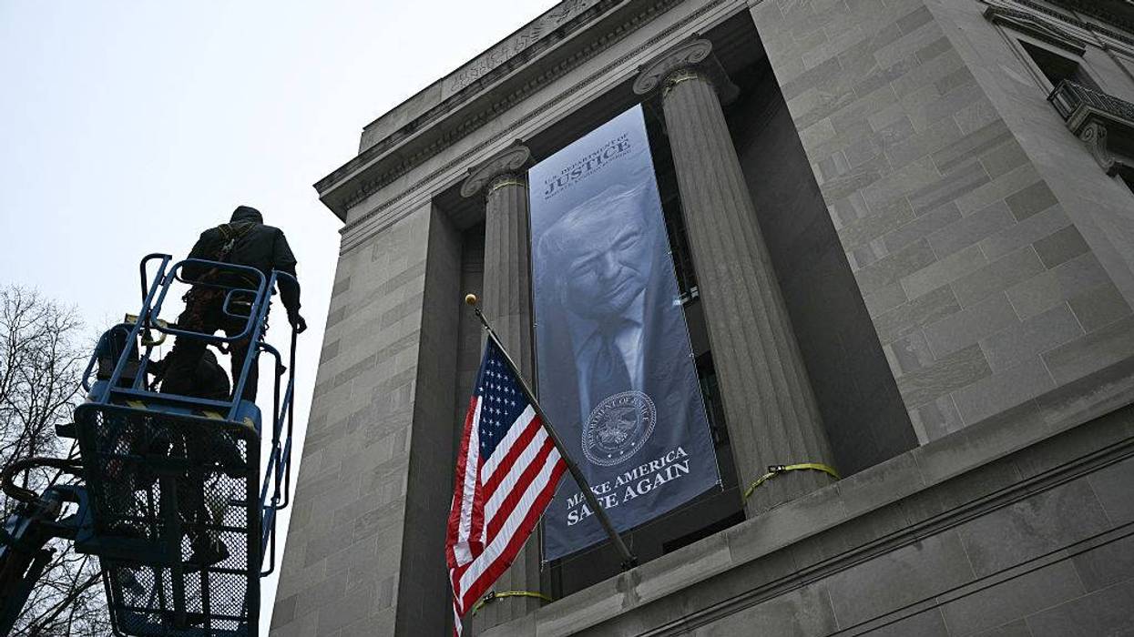 'An Abomination': Enormous 'Dictatorship-Style' Banner With Trump Face on Side of Justice Department Decried