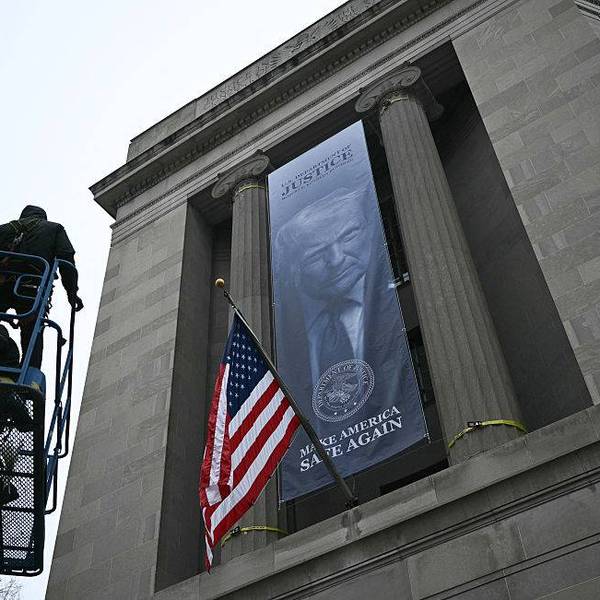 'An Abomination': Enormous 'Dictatorship-Style' Banner With Trump Face on Side of Justice Department Decried
