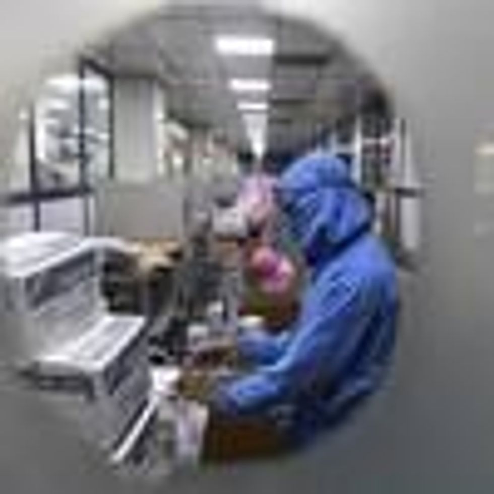 Workers pack syringes at a factory in India.