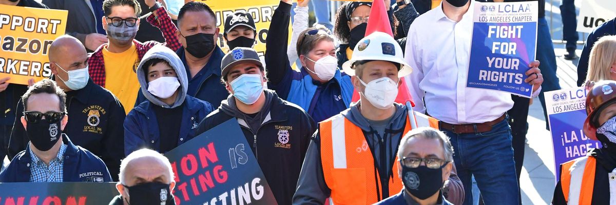 Workers rally in support of an Amazon unionization effort in Alabama