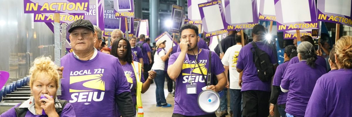 Workers walk a picket line at Los Angeles International Airport