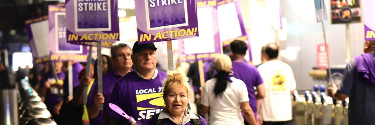 Workers walk a picket line at Los Angeles International Airport